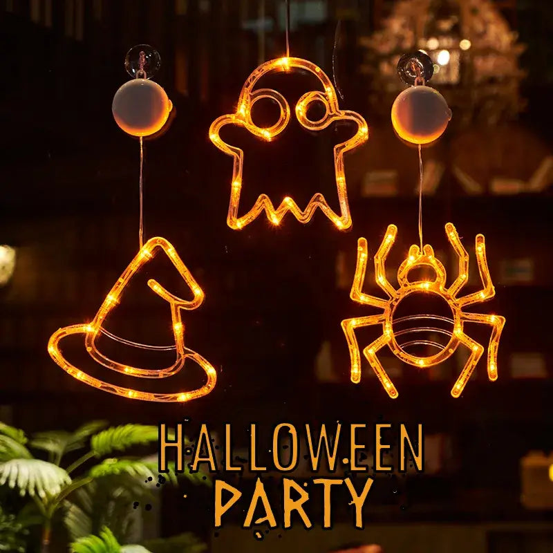Orange LED light-up Halloween window decorations featuring a battery-operated ghost, witch hat, and spider pumpkin decor for festive indoor use.