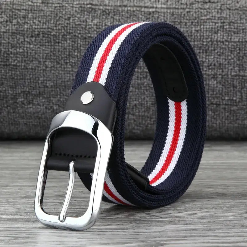 Navy blue canvas web stripe belt for men with red and white stripes, silver-toned metal buckle, and black leather accents designed for casual wear.