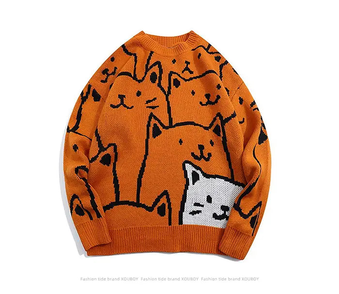 Pull ample en maille orange de xduboy, présentant un motif ludique de chats aux contours noirs avec un visage de chat blanc, dans le style Cartoon Cat Harajuku.