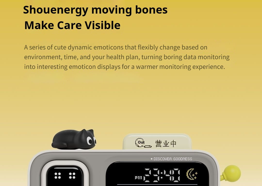 black cat-shaped figurine with large white eyes resting atop a gray duka mooda smart temperature and humidity clock displaying the time 23 40