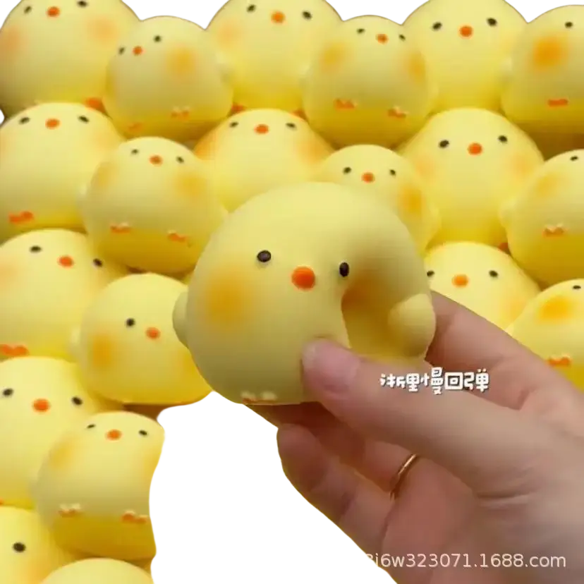 A soft yellow giant chicken squishy toy with black dot eyes and orange beak seen from the front for stress relief