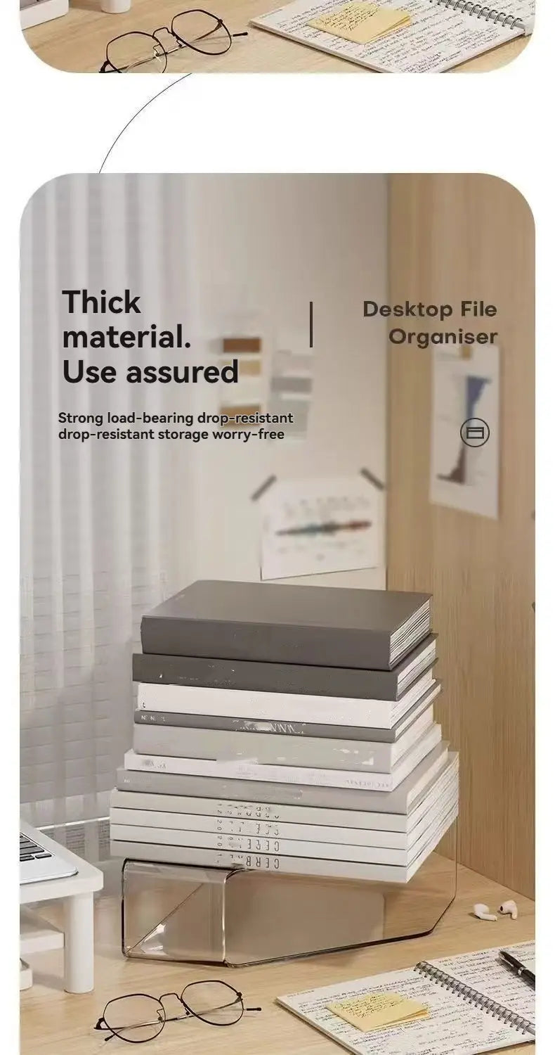 A clear acrylic desktop book stand and file organizer with a transparent base holding stacked gray, white, and black folders.