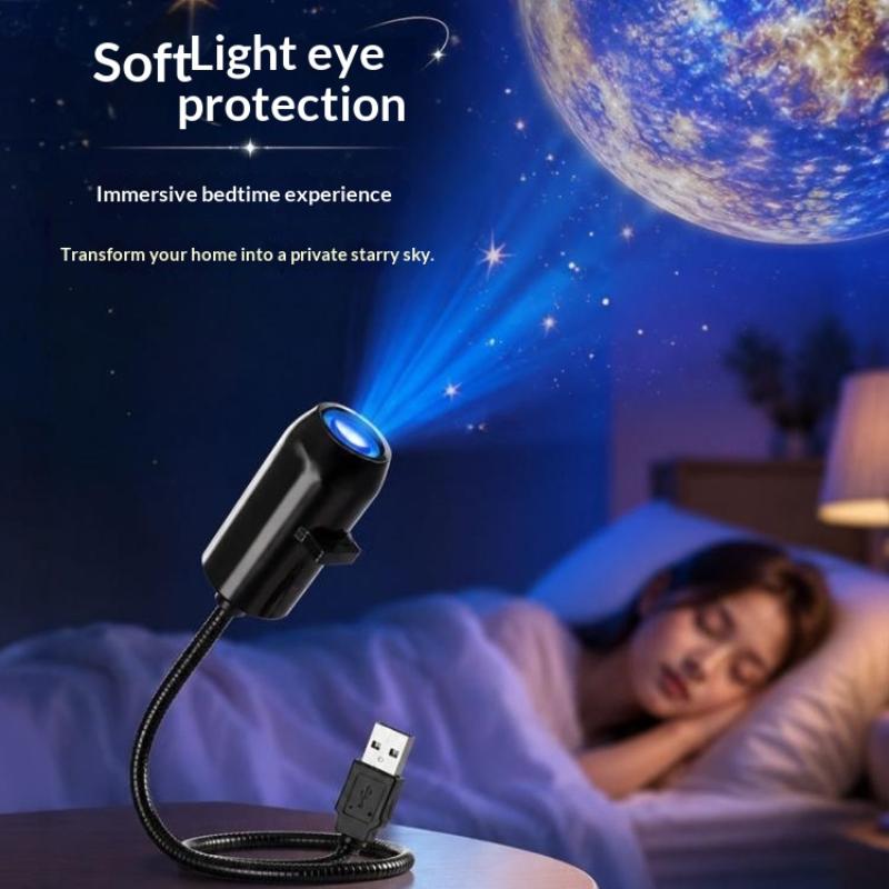 black usb-powered star galaxy projection lamp with metal gooseneck projecting a soft blue celestial night light onto the wall