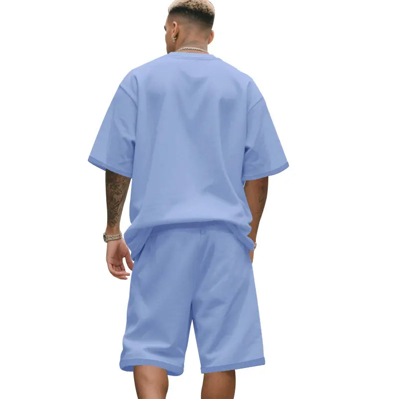 Camiseta de algodón oversize azul claro con ajuste relajado y mangas cortas, de la ropa de verano casual para hombre de dos piezas, camiseta y conjunto de pantalones cortos.