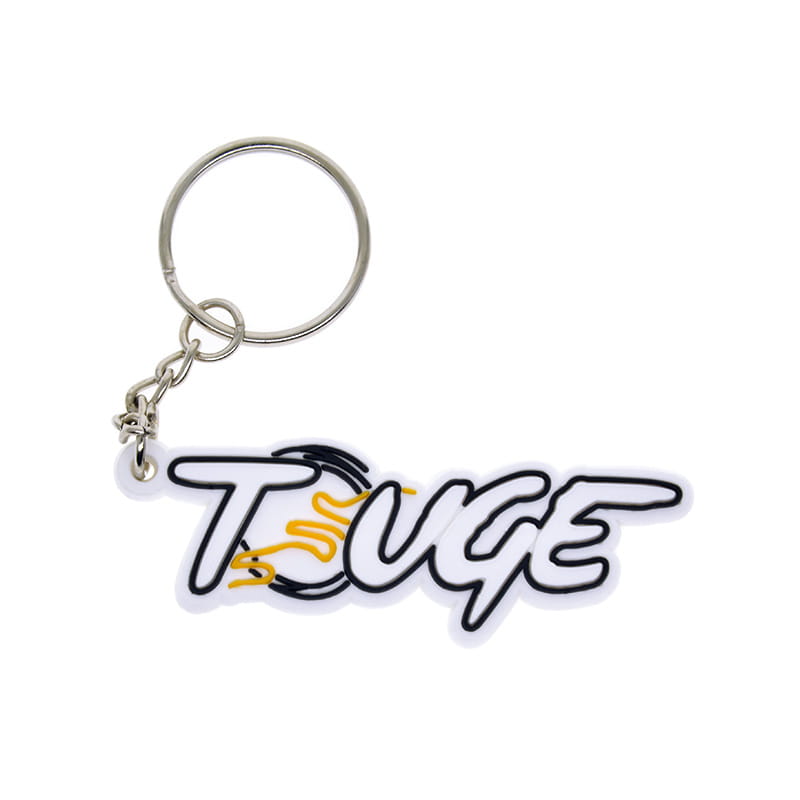 Custom soft PVC keychain featuring a white and black touge logo with yellow flame design and a silver metal ring and chain.