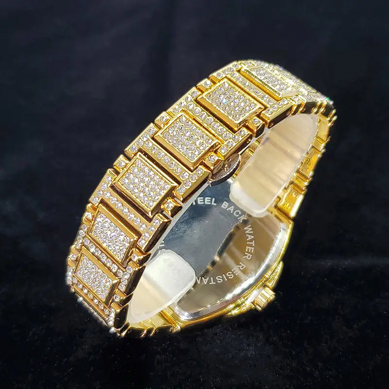 Gold-tone luxury quartz mens watch featuring a bracelet with square links densely set with clear sparkling crystals.