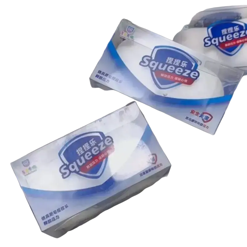 White soap squishy toy stress relief squeeze balls in clear packaging with blue and red branding for anxiety relief