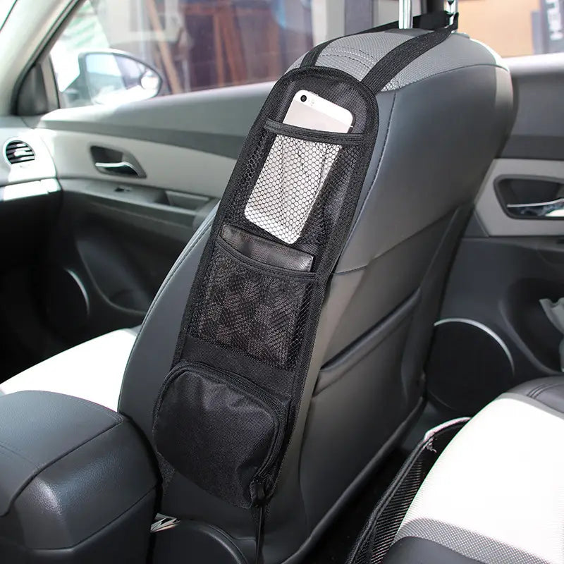 black mesh and fabric car backseat organizer with multiple compartments holding a smartphone and featuring a tablet holder