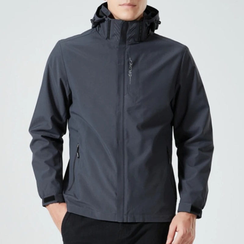 Dark gray men waterproof hiking jacket with hood and subtle brand logo on the chest designed as a hooded windbreaker.