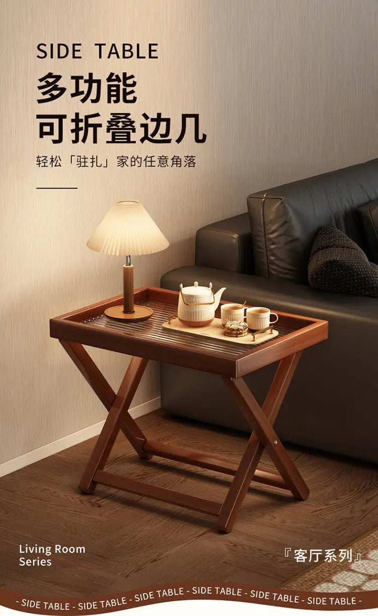 A sleek dark brown wooden foldable glass side table featuring an x-shaped base and slatted top surface highlighting key product selling points.