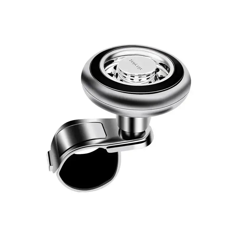 Soporte para teléfono magnético montado en el volante del automóvil, plateado y negro, con diseño circular elegante y ajuste universal con rotación de 360 grados.