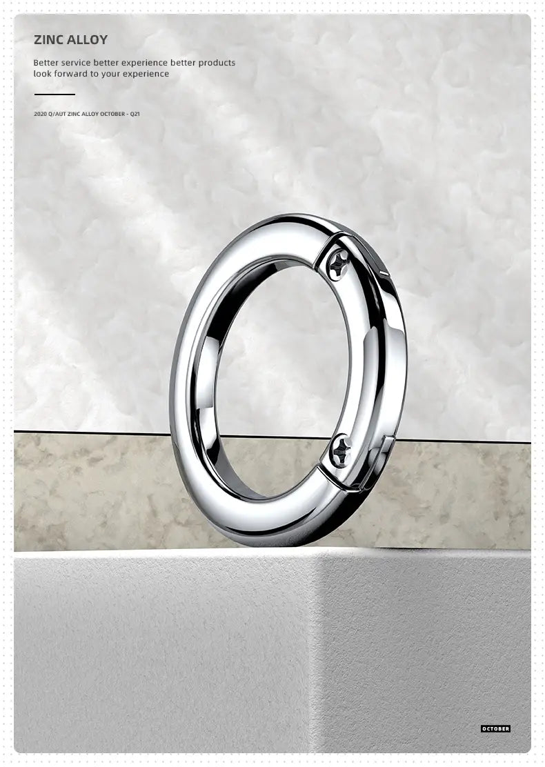 Shiny chrome-finished zinc alloy metal car keychain detachable ring holder featuring a sleek circular design with two visible screws securing its clasp.