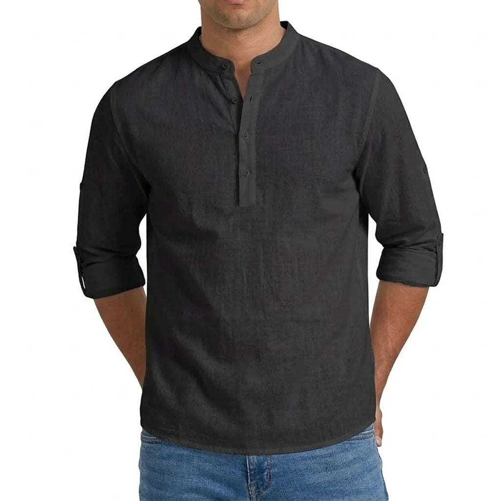 Men’s linen blend long sleeve henley shirt in black with rolled-up sleeves and a buttoned placket.