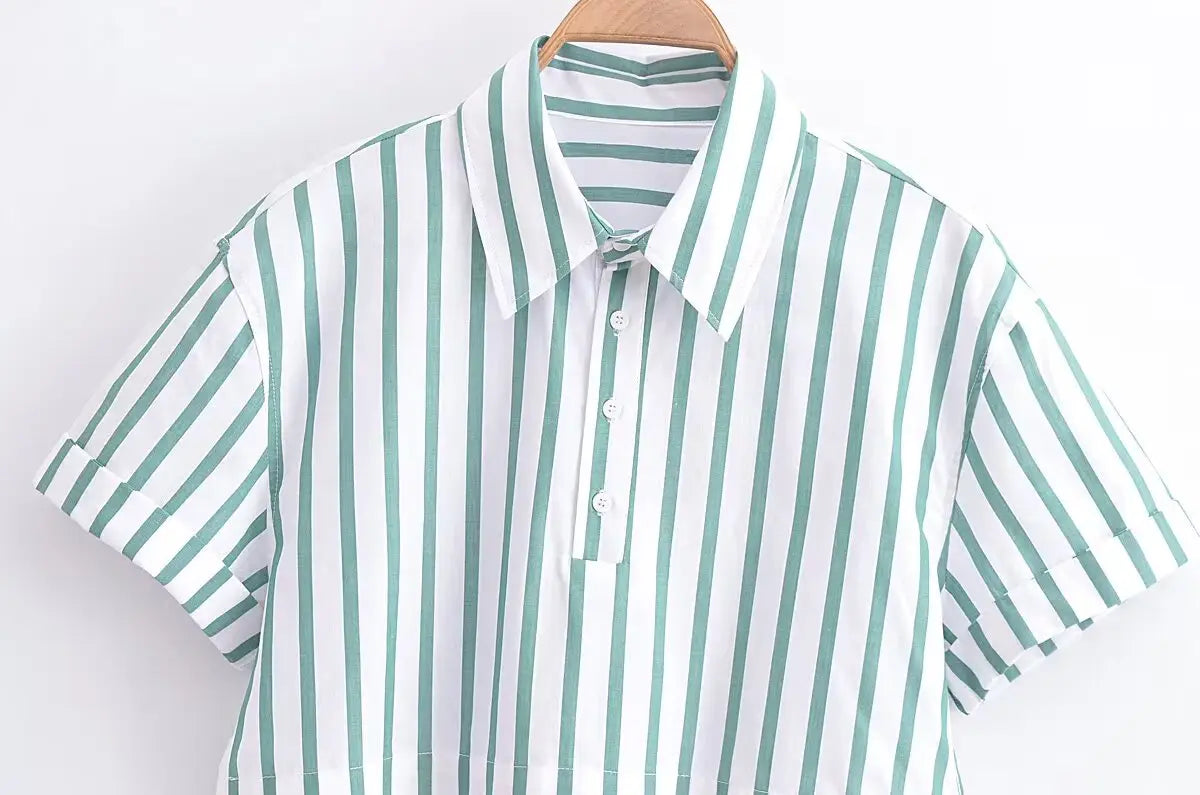 Green striped short sleeve crop shirt with vertical white stripes featuring a classic collar and neatly folded cuffs.