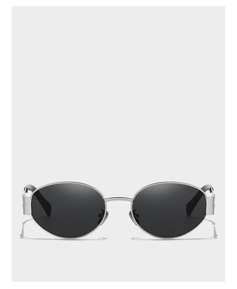 Gafas de sol ovaladas con montura plateada para mujer y hombre, con lentes gris oscuro y un diseño minimalista y elegante.