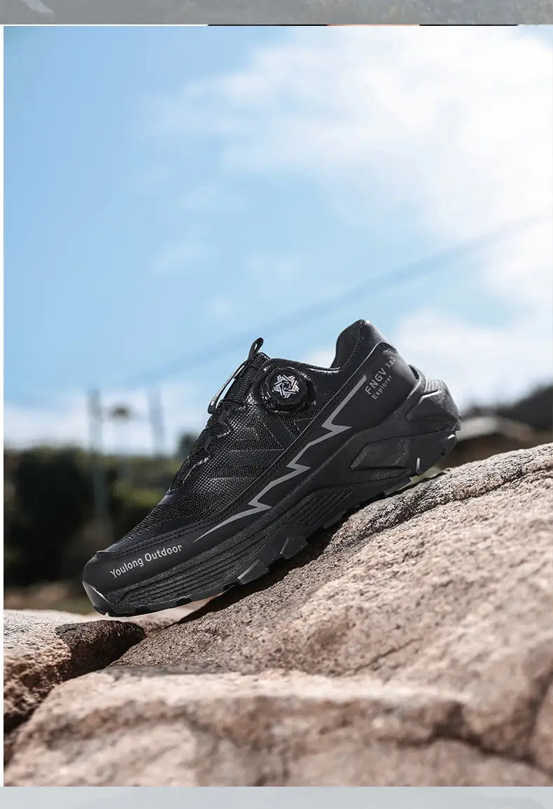 Black men hiking shoes waterproof lightweight trekking sneakers with a textured upper, white lightning bolt design on the side, and rugged sole.