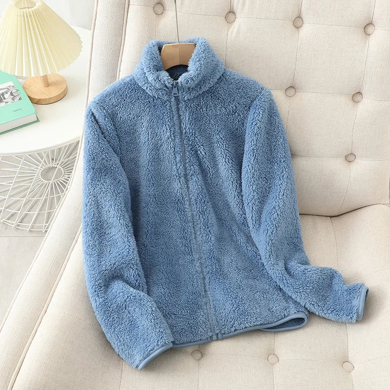 Women reversible fleece winter coat in soft light blue with plush texture and full-length zipper.