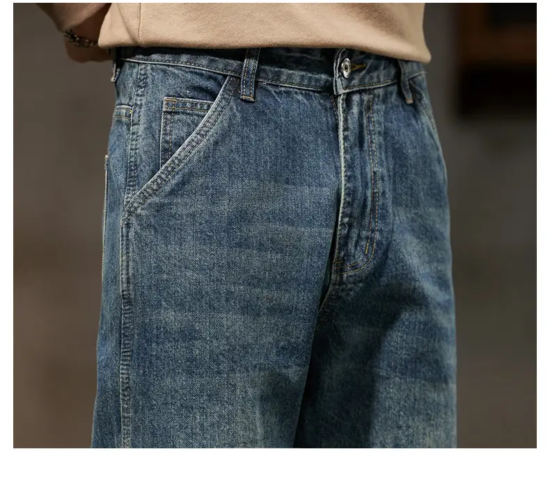 Men loose denim harem jeans in medium-wash blue with relaxed fit and classic stitching made from denim material.