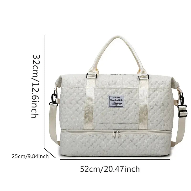 Bolsa de viaje tipo tote weekender grande acolchada de color crema, con correa ajustable para el hombro y asas superiores.