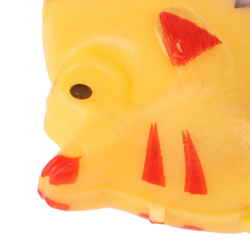 Yellow rubber duck with red triangular markings as part of a floating fish aquarium fish decors 10 pack for moving floating fish in aquariums.