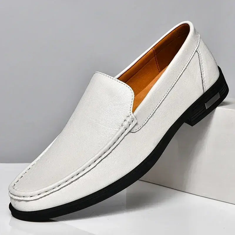 Men genuine leather slip-on dress loafer in white with black rubber sole and tan interior lining.