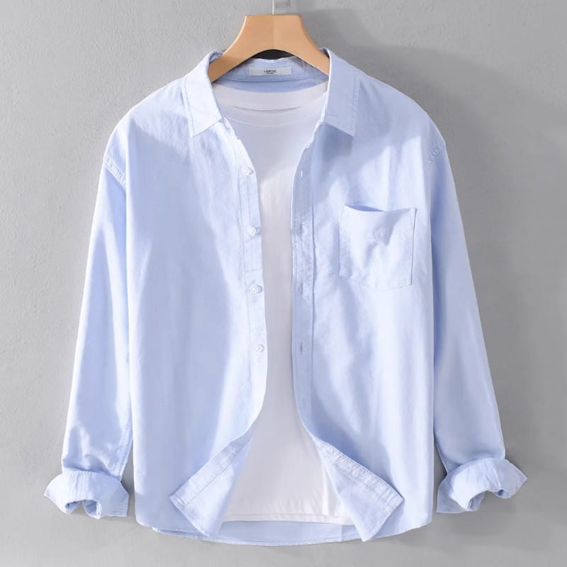 Men’s durable casual light blue long-sleeved button-up work shirt with a chest pocket and rolled cuffs.