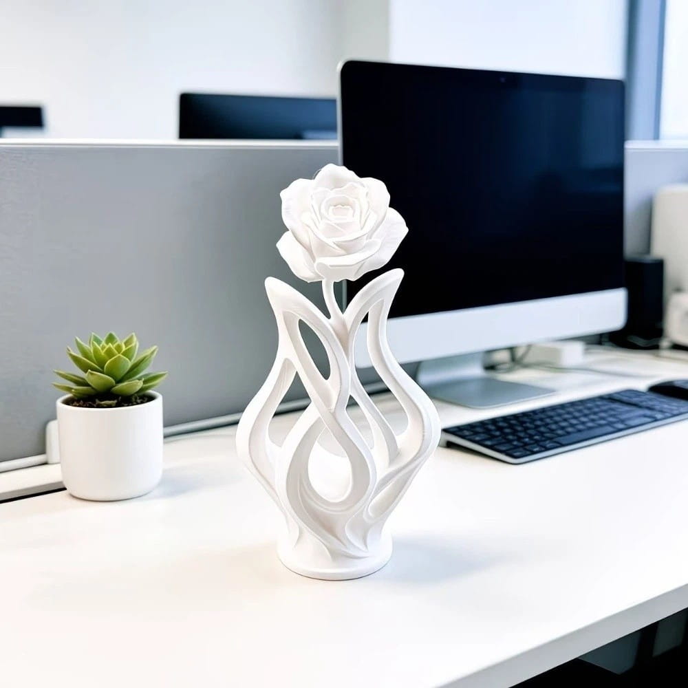 A sleek white ceramic modern rose sculpture figurine with an abstract flowing base for home decor.