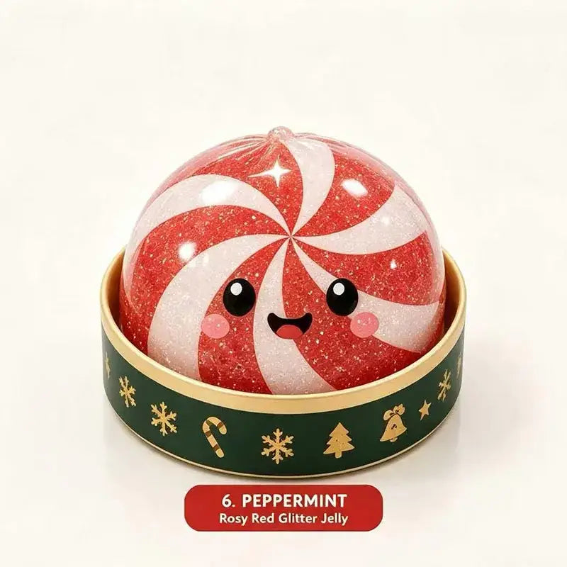 Christmas squeeze toy stress relief dumpling made of rosy red glitter jelly with a candy cane swirl pattern and a cute cartoon face nestled in a festive green tin for christmas party use.