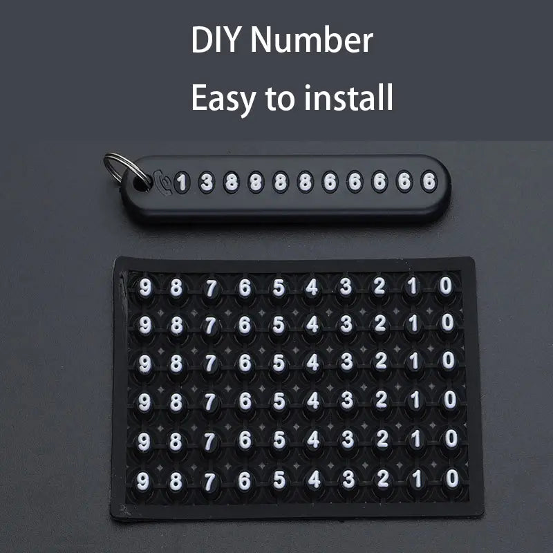 Black plastic diy number plate kit with white numerals for easy installation included in an anti-lost stainless steel car key ring pendant.