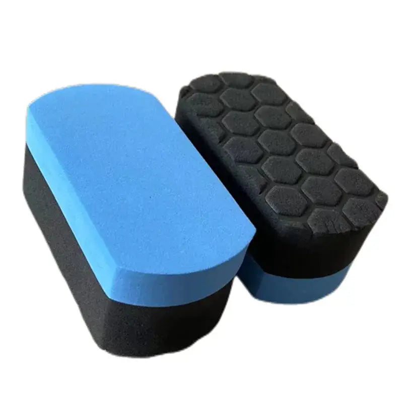 Almohadilla de acabado de esponja para lavado de autos que presenta colores azul y negro, con un patrón hexagonal texturizado en un lado.