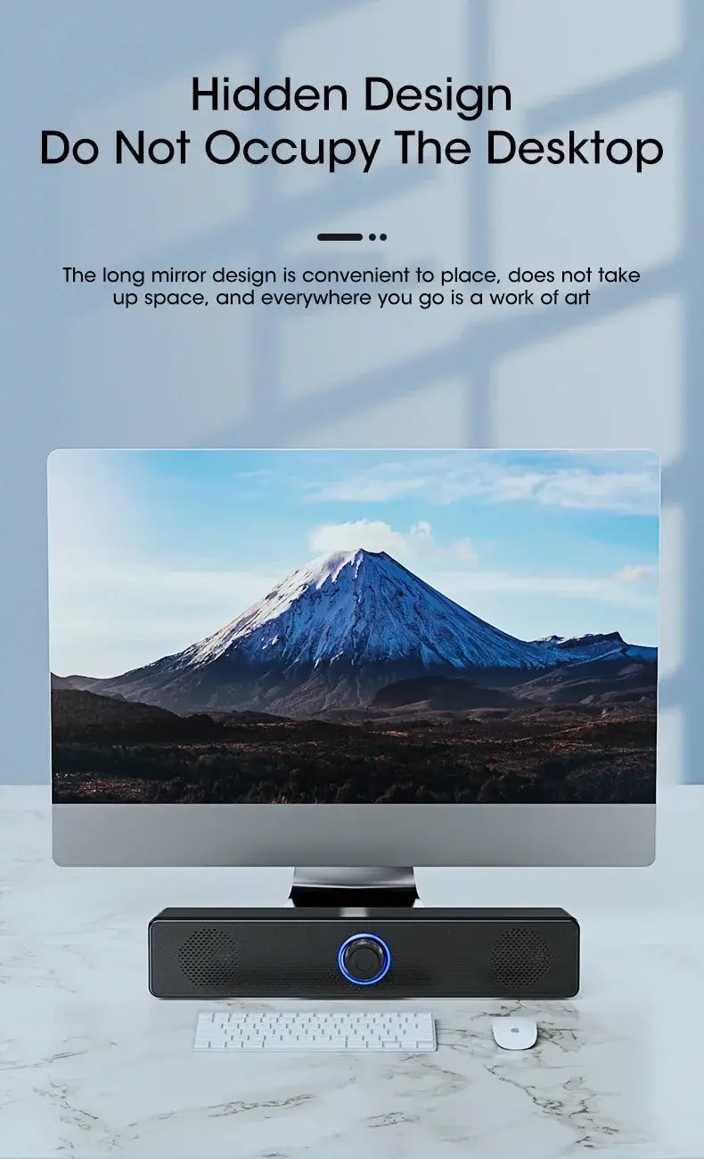Black rectangular Bluetooth computer speaker wireless desktop soundbar with circular blue illuminated control button and two speaker grilles on either side.