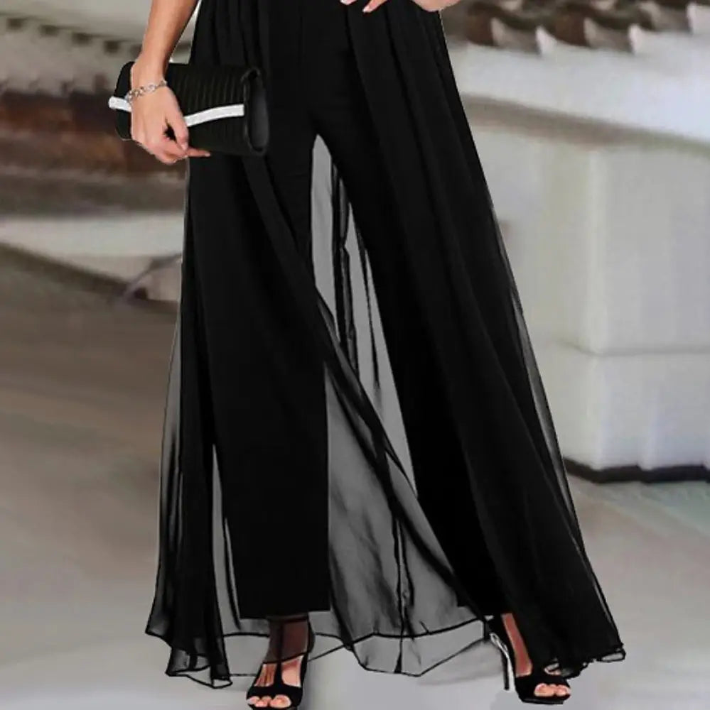 black sheer chiffon wide-leg pants with a flowing layered design featured in a women v neck elegant jumpsuit romper.
