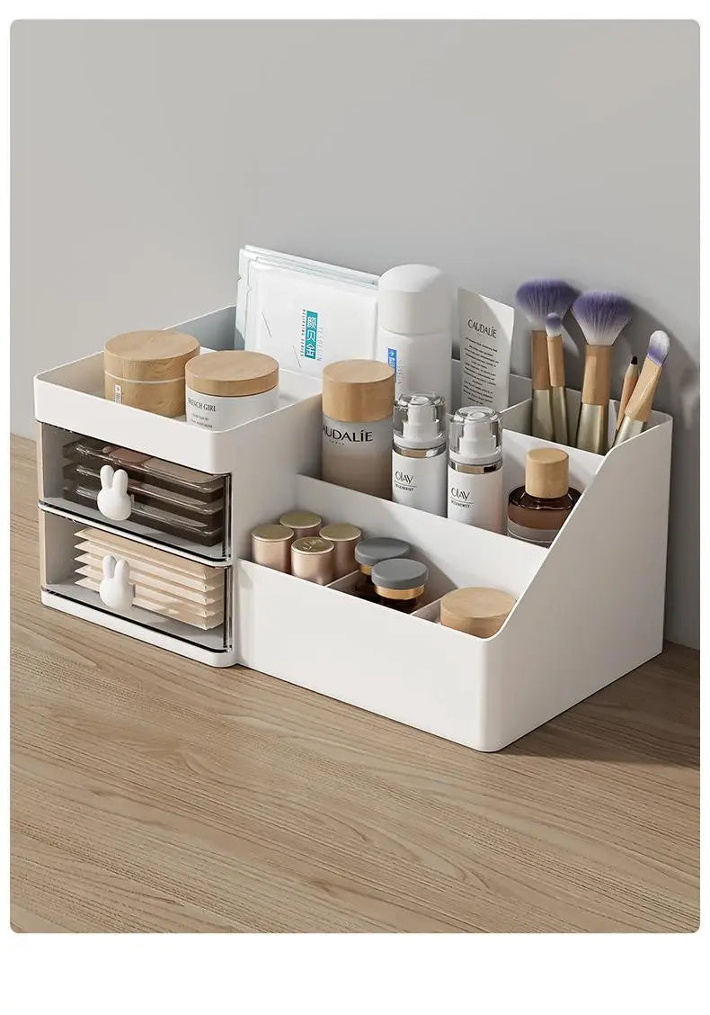 White plastic large capacity storage box in modern minimalist style with bunny-shaped handles on drawers and multiple compartments organizing skincare bottles brushes and cosmetic items.
