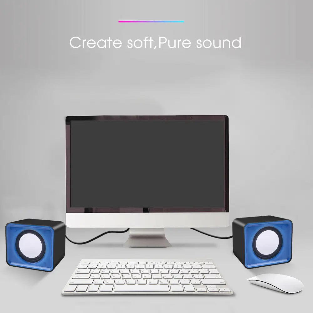 USB-Mini-Computermuslautsprecher im Stereo-Desktop-Audiosystem mit blauem und schwarzem, würfelförmigem Design sowie weißen runden Treibern für eine klare Klangwiedergabe.