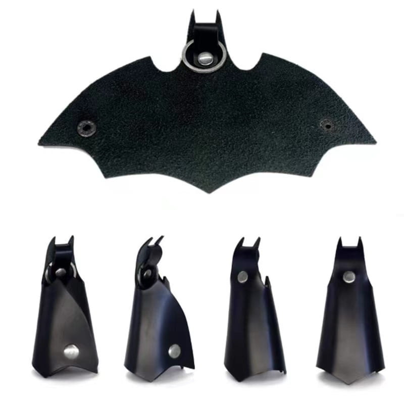 Black leather Batman-shaped keychain with metallic ring and rivets from Batman leather keychain and card holder product.