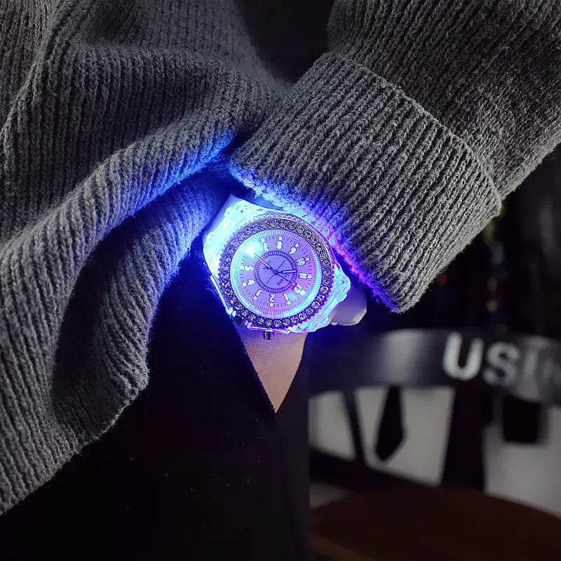A glowing, sparkling led luminous silicone watch rhinestone digital timepiece with a purple and blue led-lit face encircled by an ornate bezel.