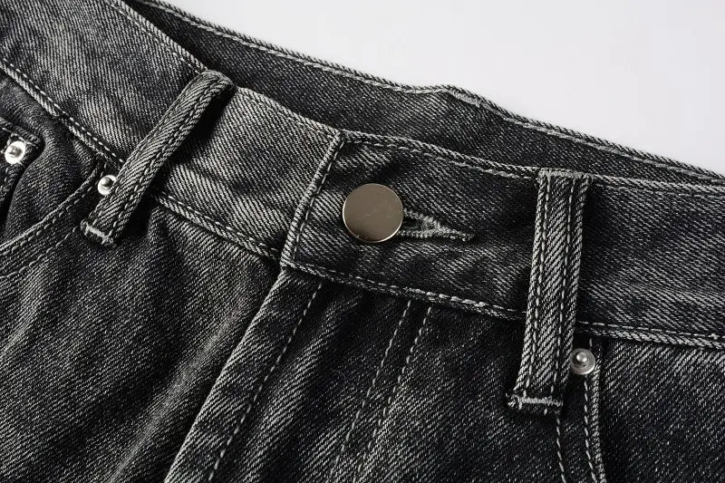 Men flare jeans distressed dark gray denim trousers with dark-wash denim fabric featuring a classic button fly and silver-toned metal hardware.