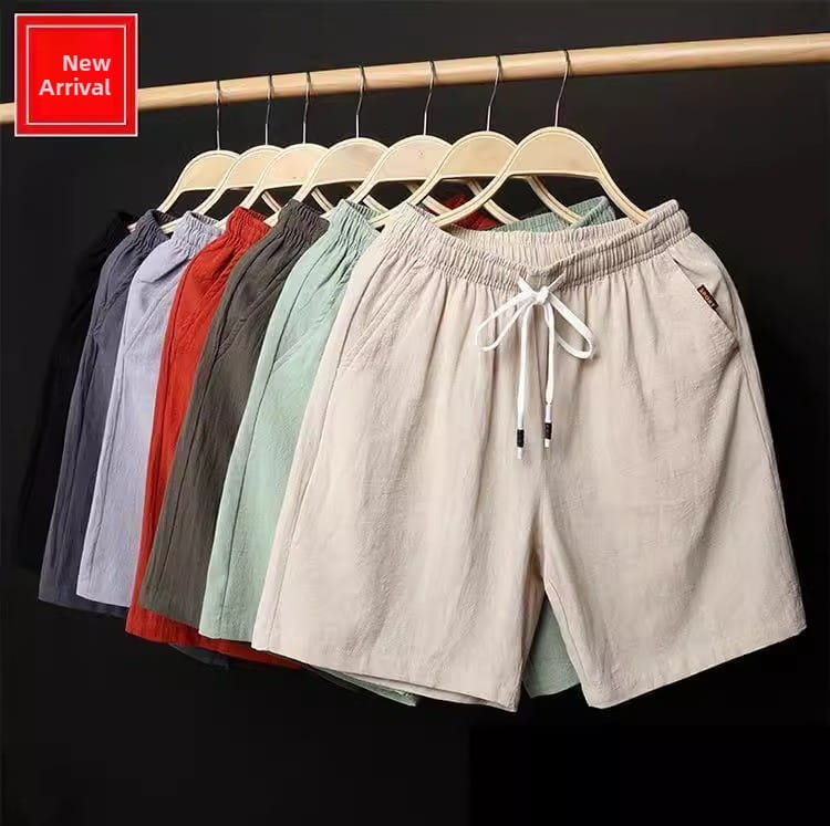 Beige Leinen-Boxer-Slips mit Kordelzugbund und dezent strukturierter Beschaffenheit, entworfen für lässige, lockere Sommer-Strandbekleidung.