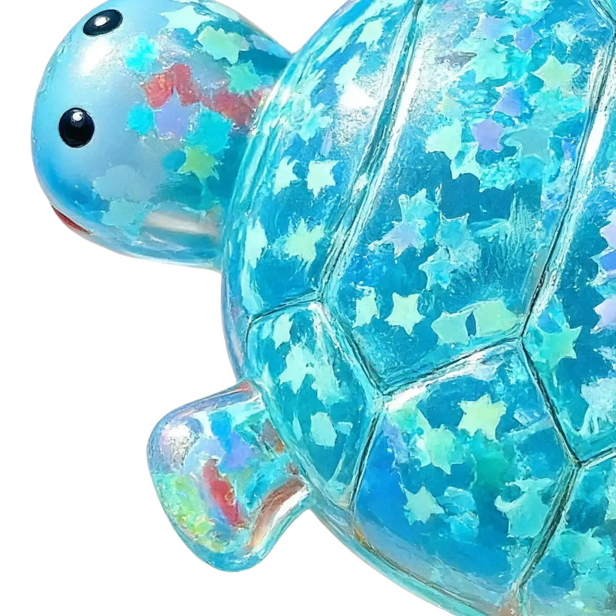Translucent blue turtle shape squeeze toy with iridescent star glitter embedded for sensory fidget use