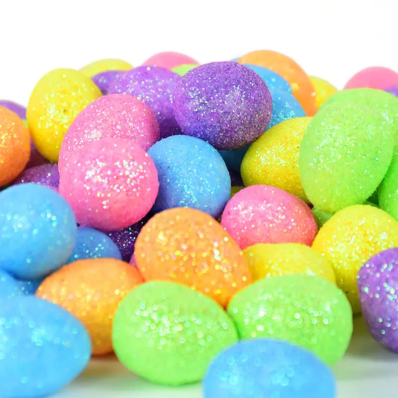 A pile of colorful glittery plastic easter eggs in vibrant pink blue green yellow and purple for glitter easter foam eggs 80 pcs diy party decor.