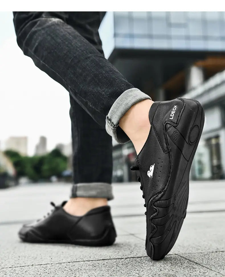 Men high top leather casual sneakers featuring a black sleek textured upper with a subtle white logo on the side.