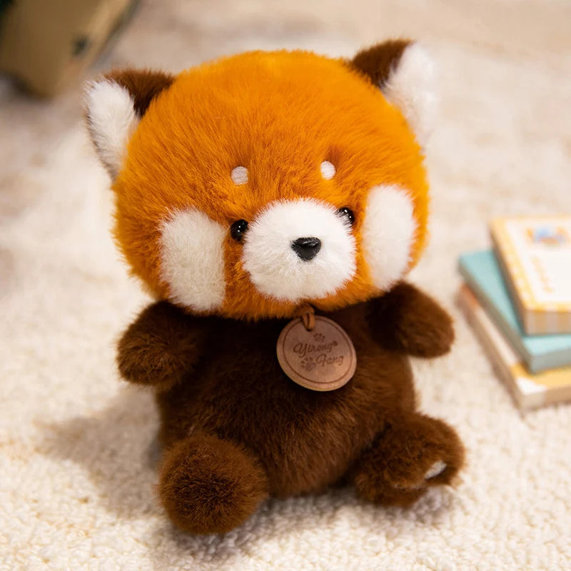 cute orange and white plush red panda fox toy with soft fur, black button eyes, and a small wooden tag around its neck from the sitting animals red panda fox sloth plush toys collection