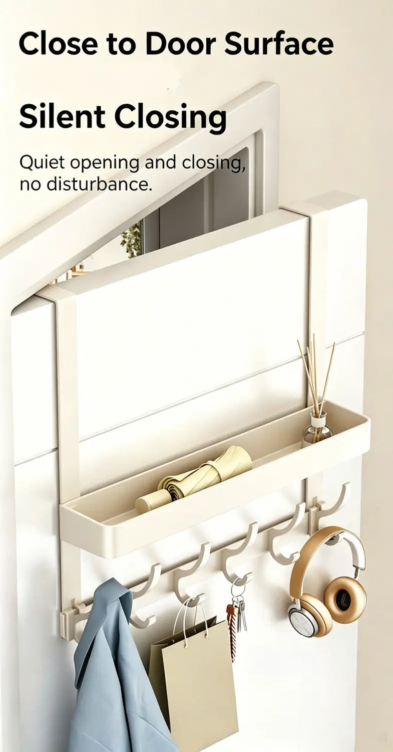 white over door organizer with hooks and shelf holding headphones keys and a jacket mounted on a door