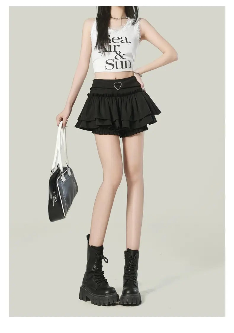 black ruffled high waist mini skirt featuring a heart-shaped belt buckle in a Y2k style.