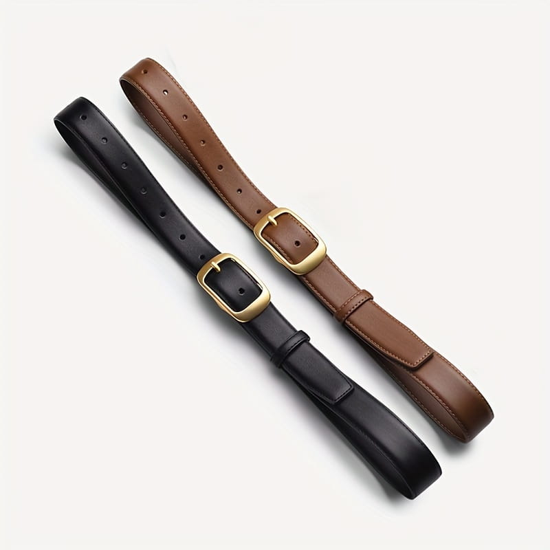 Ceintures en cuir noir et marron pour femmes avec boucles à tons dorés, conçues comme sangles pour jean.