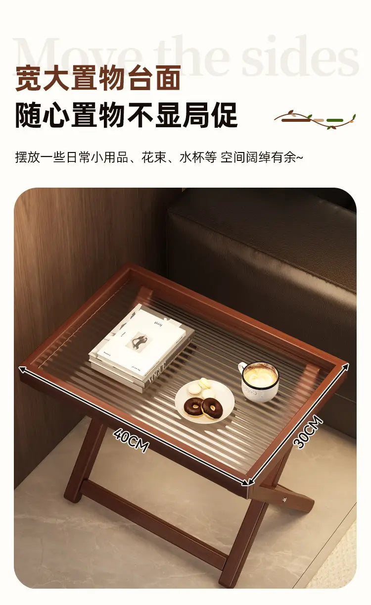 Brown wooden folding table with a clear glass top featuring horizontal ridges showcasing key product selling points of the foldable glass side table wood frame.