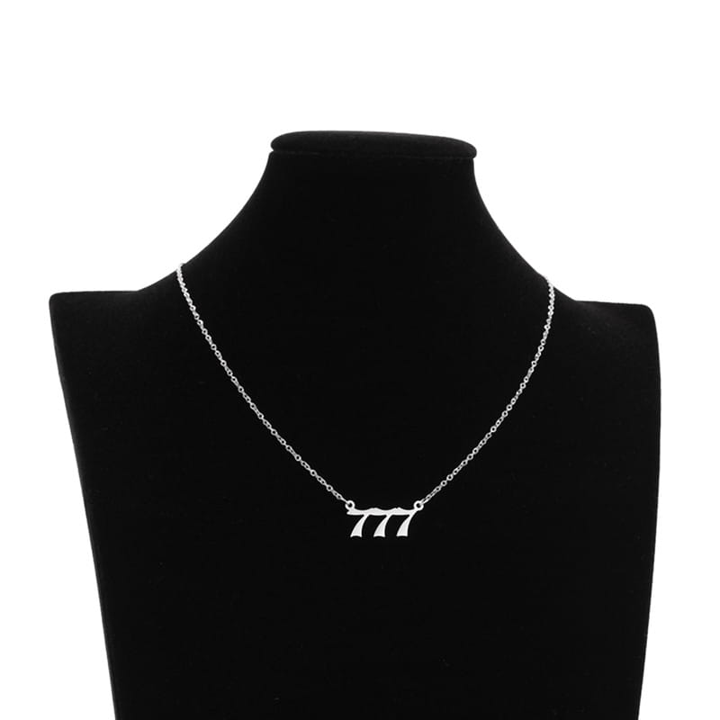 Silver chain necklace featuring a minimalist number 777 pendant in a sleek modern font for the gold angel number 7 necklace collection.