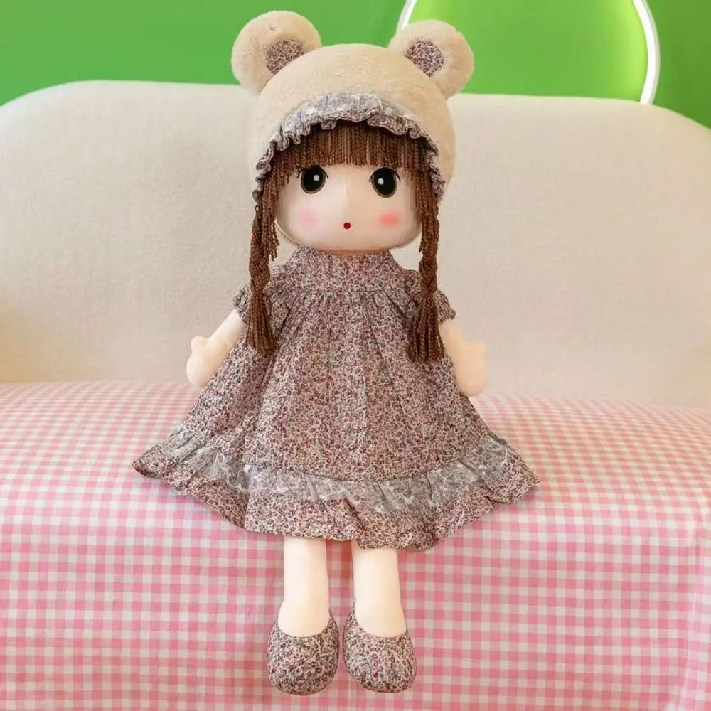 Plush doll 45cm cute stuffed animal toy featuring a soft beige bear-ear hat and brown braided hair dressed in a floral-patterned dress.