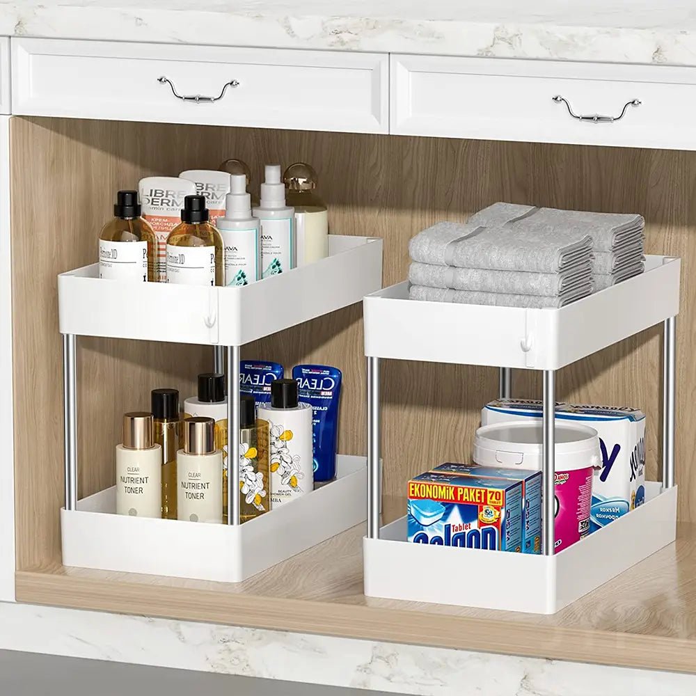 Organisateur d’évier roulant à deux niveaux de couleur blanche, rangement sur deux étages, avec pieds en acier inoxydable, conçu pour le rangement de placard de cuisine et de salle de bain.