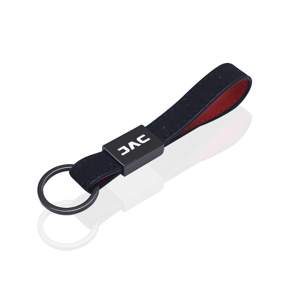 Jac leather car keychain with black jac branding featuring a sleek leather strap and red interior lining with red stitching.